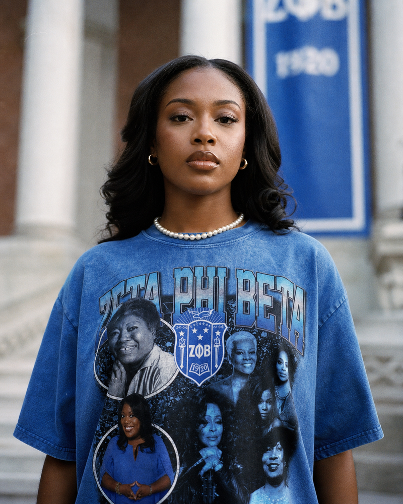 Woman wearing a blue Zeta Phi Beta sorority t-shirt in front of a building.